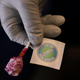 Nurse Natasha Garcia prepares a lollipop and an “I Got My COVID-19 Vaccine” sticker for a recipient in a mobile clinic set up in the parking lot of a shopping center in Orange, California.